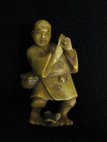 Carved Ivory Figurine of a Man basket