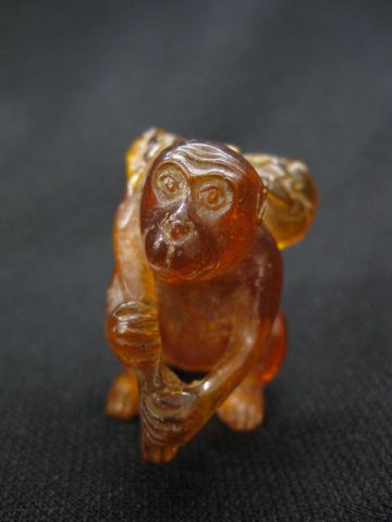 Amber Netsuke of a Monkey fruit