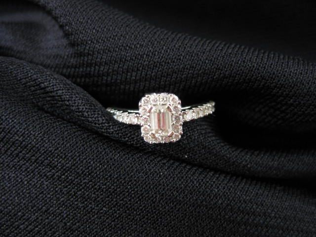 Diamond Ring .25 emerald cut surrounded
