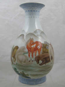 A large Chinese vase with eight horses