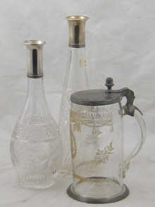 A pewter lidded glass tankard with 14f76d