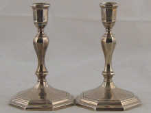 A pair of cast silver candlesticks 14f780