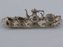 A miniature silver four piece tea 14f7a4