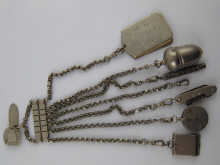 A silver plated chatelaine with six
