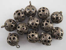 A set of twelve antique pierced buttons