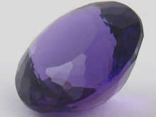 A loose polished round amethyst approx.