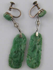 A pair of carved jade drop earrings 14f7d9