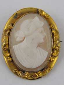An oval shell cameo set in gilded metal