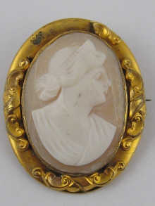 An oval shell cameo set in gilded