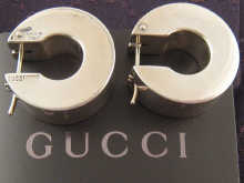 A boxed pair of Gucci silver earrings