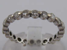 A diamond eternity ring set in