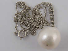 A pearl and diamond pendant the pearl