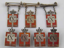 A mixed lot comprising three badges 14f7f9
