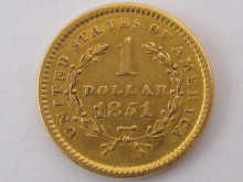 A fine USA gold one dollar coin dated