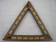 A triangular cribbage board with peg