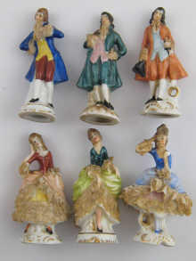 A set of six ceramic menu holder figures