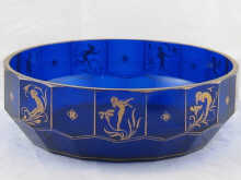 A cobalt blue facetted glass bowl