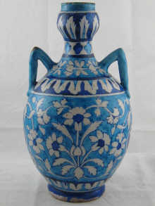 An Indian two handled ceramic vase with