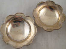 A pair of silver bon bon dishes