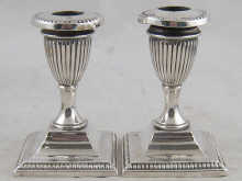 A pair of silver plated dwarf candle 14f8c3