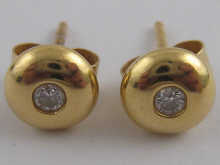 A pair of hallmarked 18 carat gold 14f905