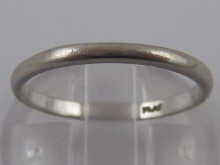 A platinum band ring.