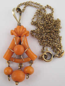 A coral pendant set in yellow metal 14f92e