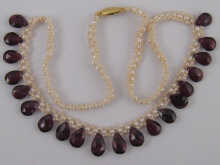 A seed pearl and garnet necklace