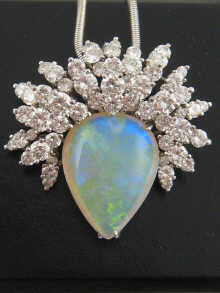 A platinum opal and diamond pendant 14f945