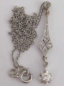 A diamond pendant set in white 14f95a