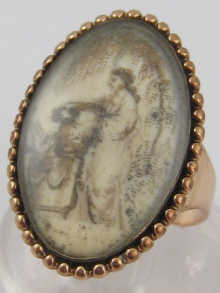A mourning ring set in yellow metal