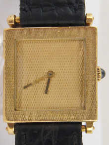 An 18 carat gold mid size wrist