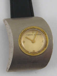 A metal wrist watch by Pierre Cardin