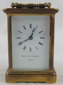 A modern brass carriage clock Matthew