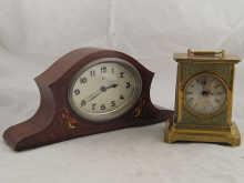 A mahogany mantle clock with inlaid