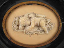 A very fine carved ivory plaque