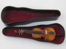 A miniature violoncello length
