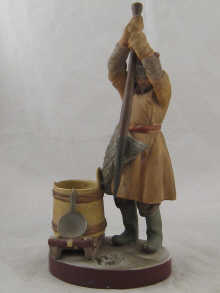 A Russian ceramic figure of a man