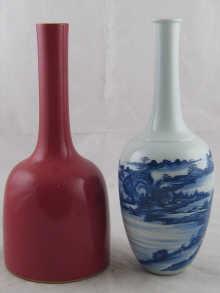 A tall white Chinese vase with