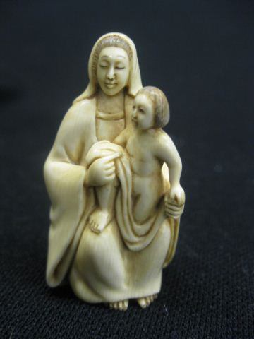 Carved Ivory Netsuke of Mother 14fd41