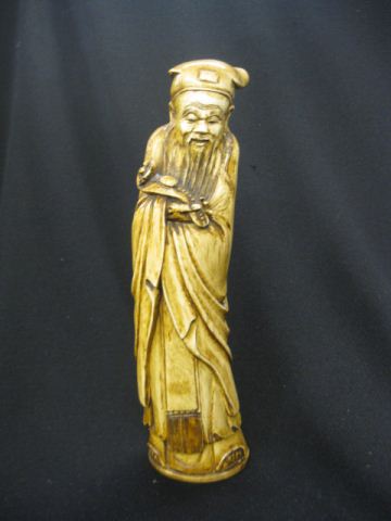 Carved Ivory Figurine of a Scholar holding