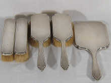 A silver dressing table set of two hairbrushes