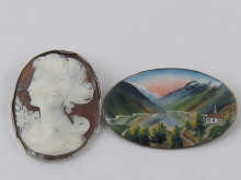 An oval brooch enamelled with a mountain