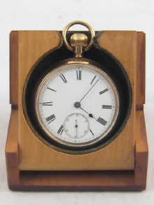A gold plated pocket watch in travelling