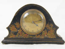 A 1930s lacquered French mantel clock.