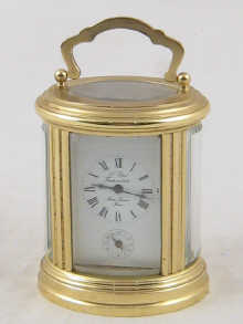 An oval brass French carriage clock 150078