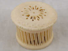 A pierced ivory circular box with screw