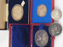 Five commemorative silver medals being