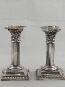 A pair of Corinthian column candle