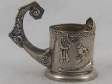 A heavy Russian silver tea glass